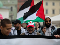 Participants in a pro-Palestinian protest gather on the Main Square and then proceed to the US Consulate and the Jagiellonian University in...