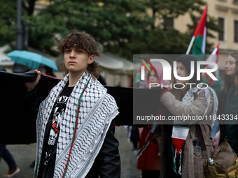 Participants in a pro-Palestinian protest gather on the Main Square and then proceed to the US Consulate and the Jagiellonian University in...