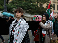 Participants in a pro-Palestinian protest gather on the Main Square and then proceed to the US Consulate and the Jagiellonian University in...