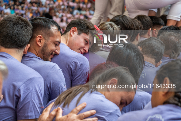 Members of Colla Jove Xiquets de Tarragona build a human tower during the Concurs de Castells competition in Tarragona, Spain, on October 6,...