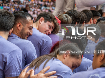 Members of Colla Jove Xiquets de Tarragona build a human tower during the Concurs de Castells competition in Tarragona, Spain, on October 6,...