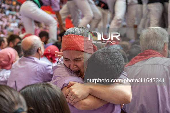 Members of Colla Jove Xiquets de Tarragona celebrate the victory after building a human tower during the Concurs de Castells competition in...