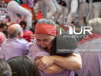 Members of Colla Jove Xiquets de Tarragona celebrate the victory after building a human tower during the Concurs de Castells competition in...