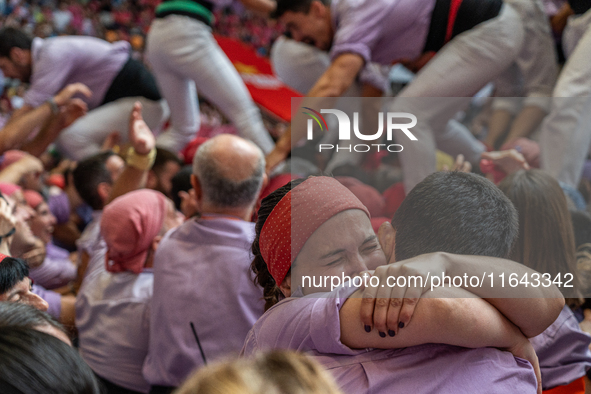 Members of Colla Jove Xiquets de Tarragona celebrate the victory after building a human tower during the Concurs de Castells competition in...