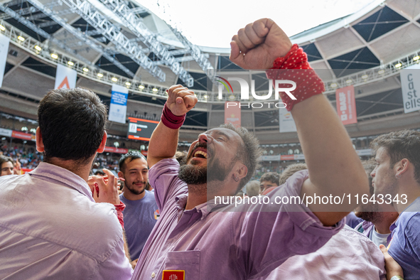 Members of Colla Jove Xiquets de Tarragona celebrate the victory after building a human tower during the Concurs de Castells competition in...