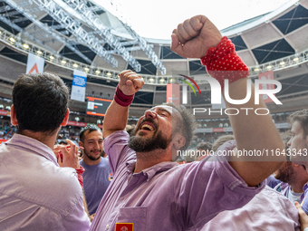 Members of Colla Jove Xiquets de Tarragona celebrate the victory after building a human tower during the Concurs de Castells competition in...