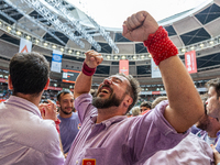 Members of Colla Jove Xiquets de Tarragona celebrate the victory after building a human tower during the Concurs de Castells competition in...