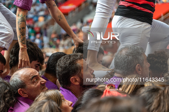 Members of Moixiganguers d'Igualada build a human tower during the Concurs de Castells competition in Tarragona, Spain, on October 6, 2024. 