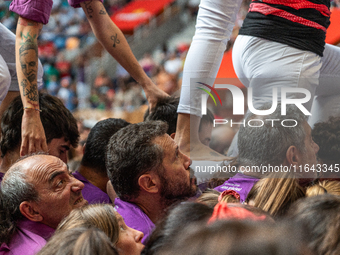 Members of Moixiganguers d'Igualada build a human tower during the Concurs de Castells competition in Tarragona, Spain, on October 6, 2024....