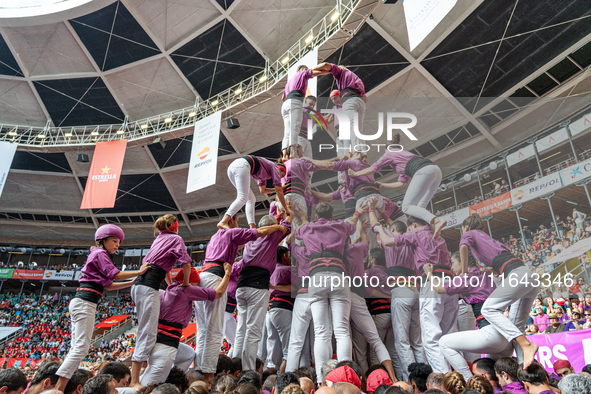 Members of Moixiganguers d'Igualada build a human tower during the Concurs de Castells competition in Tarragona, Spain, on October 6, 2024. 