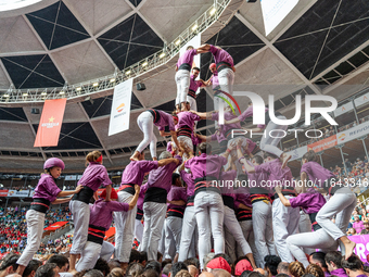 Members of Moixiganguers d'Igualada build a human tower during the Concurs de Castells competition in Tarragona, Spain, on October 6, 2024....