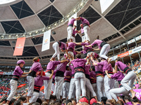 Members of Moixiganguers d'Igualada build a human tower during the Concurs de Castells competition in Tarragona, Spain, on October 6, 2024....