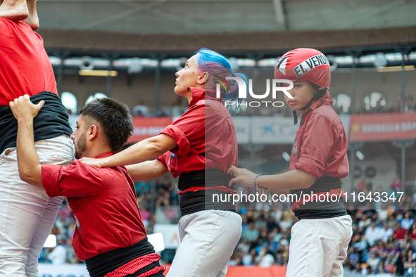 Members of the colla Nens del Vendrell build a human tower during the Concurs de Castells competition in Tarragona, Spain, on October 6, 202...