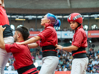 Members of the colla Nens del Vendrell build a human tower during the Concurs de Castells competition in Tarragona, Spain, on October 6, 202...