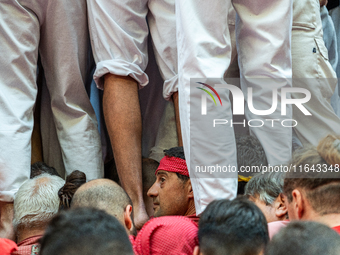 Members of the colla Nens del Vendrell build a human tower during the Concurs de Castells competition in Tarragona, Spain, on October 6, 202...