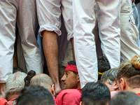 Members of the colla Nens del Vendrell build a human tower during the Concurs de Castells competition in Tarragona, Spain, on October 6, 202...