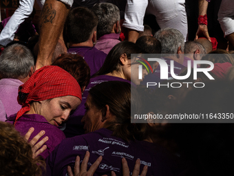 Members of the colla Moixiganguers d'Igualada build a human tower during the Concurs de Castells competition in Tarragona, Spain, on October...