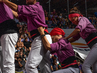 Members of the colla Moixiganguers d'Igualada build a human tower during the Concurs de Castells competition in Tarragona, Spain, on October...