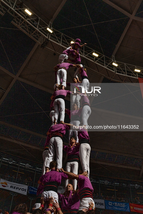 Members of the colla Moixiganguers d'Igualada build a human tower during the Concurs de Castells competition in Tarragona, Spain, on October...