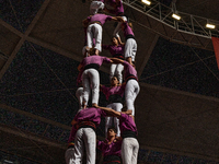 Members of the colla Moixiganguers d'Igualada build a human tower during the Concurs de Castells competition in Tarragona, Spain, on October...