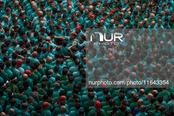 Members of the colla Castellers de Vilafranca build a human tower during the Concurs de Castells competition in Tarragona, Spain, on October...