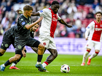 FC Groningen midfielder Luciano Valente and AFC Ajax Amsterdam forward Brian Brobbey play during the match between Ajax and Groningen at the...