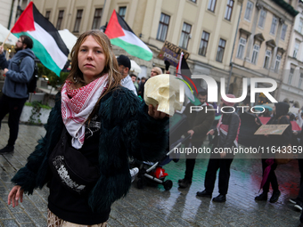 Participants in a pro-Palestinian protest gather on the Main Square and then proceed to the US Consulate and the Jagiellonian University in...