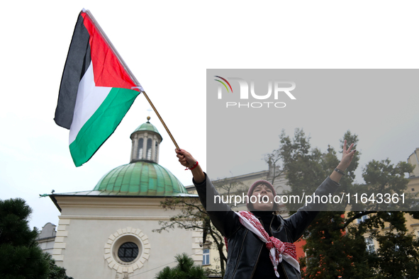 Participants in a pro-Palestinian protest gather on the Main Square and then proceed to the US Consulate and the Jagiellonian University in...