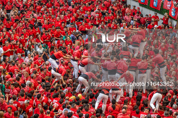 Members of Colla Joves Xiquets de Valls build a human tower during the Concurs de Castells competition in Tarragona, Spain, on October 6, 20...