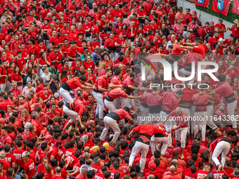 Members of Colla Joves Xiquets de Valls build a human tower during the Concurs de Castells competition in Tarragona, Spain, on October 6, 20...