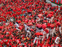 Members of Colla Joves Xiquets de Valls build a human tower during the Concurs de Castells competition in Tarragona, Spain, on October 6, 20...