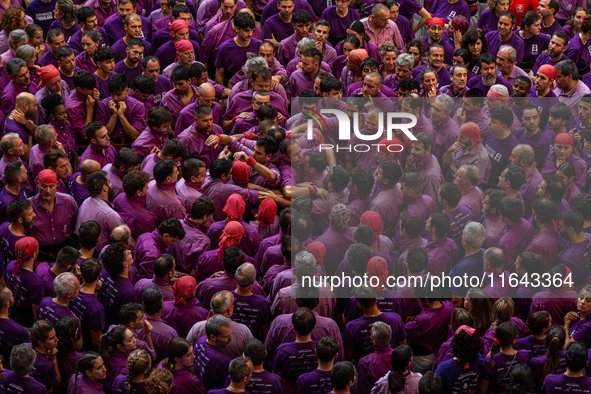 Members of Moixiganguers d'Igualada build a human tower during the Concurs de Castells competition in Tarragona, Spain, on October 6, 2024. 