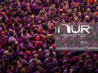 Members of Moixiganguers d'Igualada build a human tower during the Concurs de Castells competition in Tarragona, Spain, on October 6, 2024....