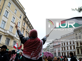 Participants in a pro-Palestinian protest gather on the Main Square and then proceed to the US Consulate and the Jagiellonian University in...