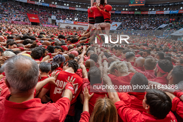 Members of Colla Joves Xiquets de Valls build a human tower during the Concurs de Castells competition in Tarragona, Spain, on October 6, 20...