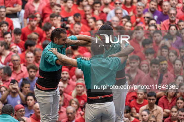 Members of the colla Castellers de Vilafranca build a human tower during the Concurs de Castells competition in Tarragona, Spain, on October...