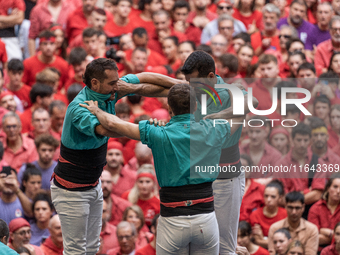 Members of the colla Castellers de Vilafranca build a human tower during the Concurs de Castells competition in Tarragona, Spain, on October...