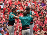 Members of the colla Castellers de Vilafranca build a human tower during the Concurs de Castells competition in Tarragona, Spain, on October...