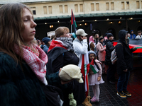 Participants in a pro-Palestinian protest gather on the Main Square and then proceed to the US Consulate and the Jagiellonian University in...