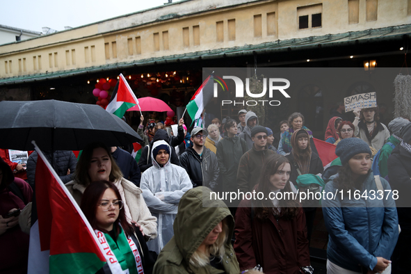 Participants in a pro-Palestinian protest gather on the Main Square and then proceed to the US Consulate and the Jagiellonian University in...