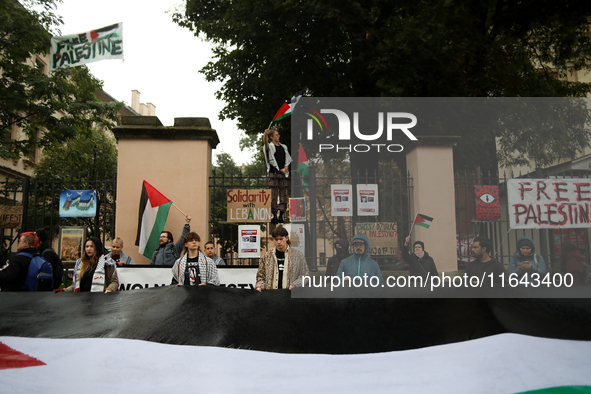 Participants in a pro-Palestinian protest gather on the Main Square and then proceed to the US Consulate and the Jagiellonian University in...