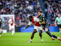 AFC Ajax Amsterdam forward Brian Brobbey and FC Groningen defender Marco Rente play during the match between Ajax and Groningen at the Johan...