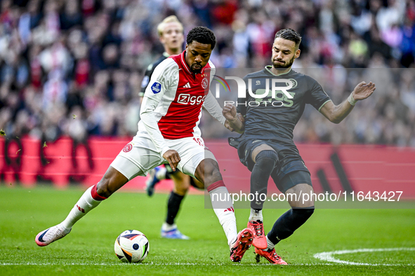 AFC Ajax Amsterdam forward Chuba Akpom and FC Groningen defender Marco Rente play during the match between Ajax and Groningen at the Johan C...