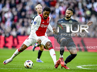 AFC Ajax Amsterdam forward Chuba Akpom and FC Groningen defender Marco Rente play during the match between Ajax and Groningen at the Johan C...