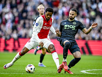 AFC Ajax Amsterdam forward Chuba Akpom and FC Groningen defender Marco Rente play during the match between Ajax and Groningen at the Johan C...