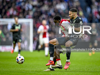 AFC Ajax Amsterdam forward Brian Brobbey and FC Groningen defender Marco Rente play during the match between Ajax and Groningen at the Johan...