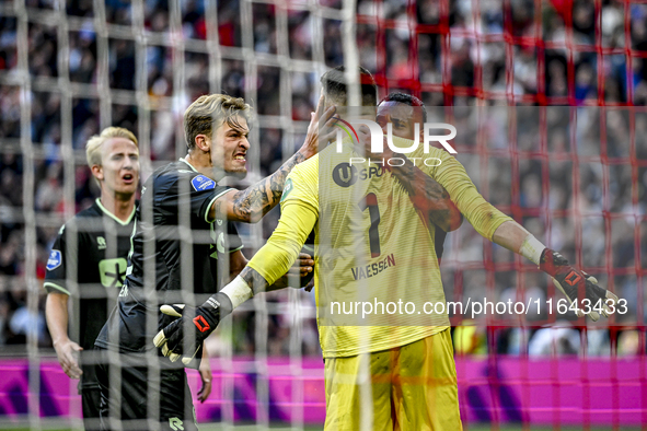 FC Groningen midfielder Luciano Valente, FC Groningen goalkeeper Etienne Vaessen, and FC Groningen defender Leandro Bacuna participate in th...