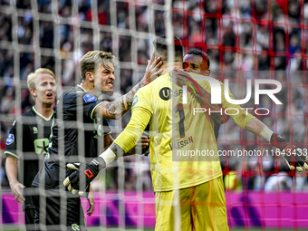 FC Groningen midfielder Luciano Valente, FC Groningen goalkeeper Etienne Vaessen, and FC Groningen defender Leandro Bacuna participate in th...