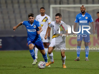 Stefan Ilic of Zabbar St. Patrick moves with the ball while Nikolai Muscat of Marsaxlokk closely attends during the Malta 360 Sports Premier...