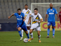 Stefan Ilic of Zabbar St. Patrick moves with the ball while Nikolai Muscat of Marsaxlokk closely attends during the Malta 360 Sports Premier...